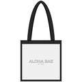 Clear PVC tote bag with "Aloha Bae" print from Printify, featuring sturdy handles and spacious interior for everyday use.