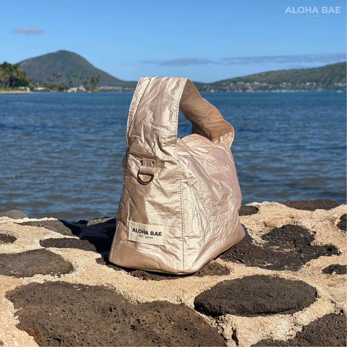 Aloha Bae champagne-colored hobo bag with adjustable strap and soft leather texture, stylish and spacious for everyday use.