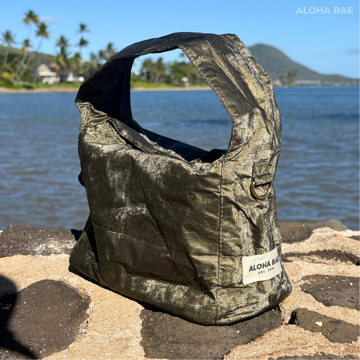 Aloha Bae Maritime Pine hobo bag with woven design, featuring a slouchy shape and adjustable strap, made of eco-friendly materials.