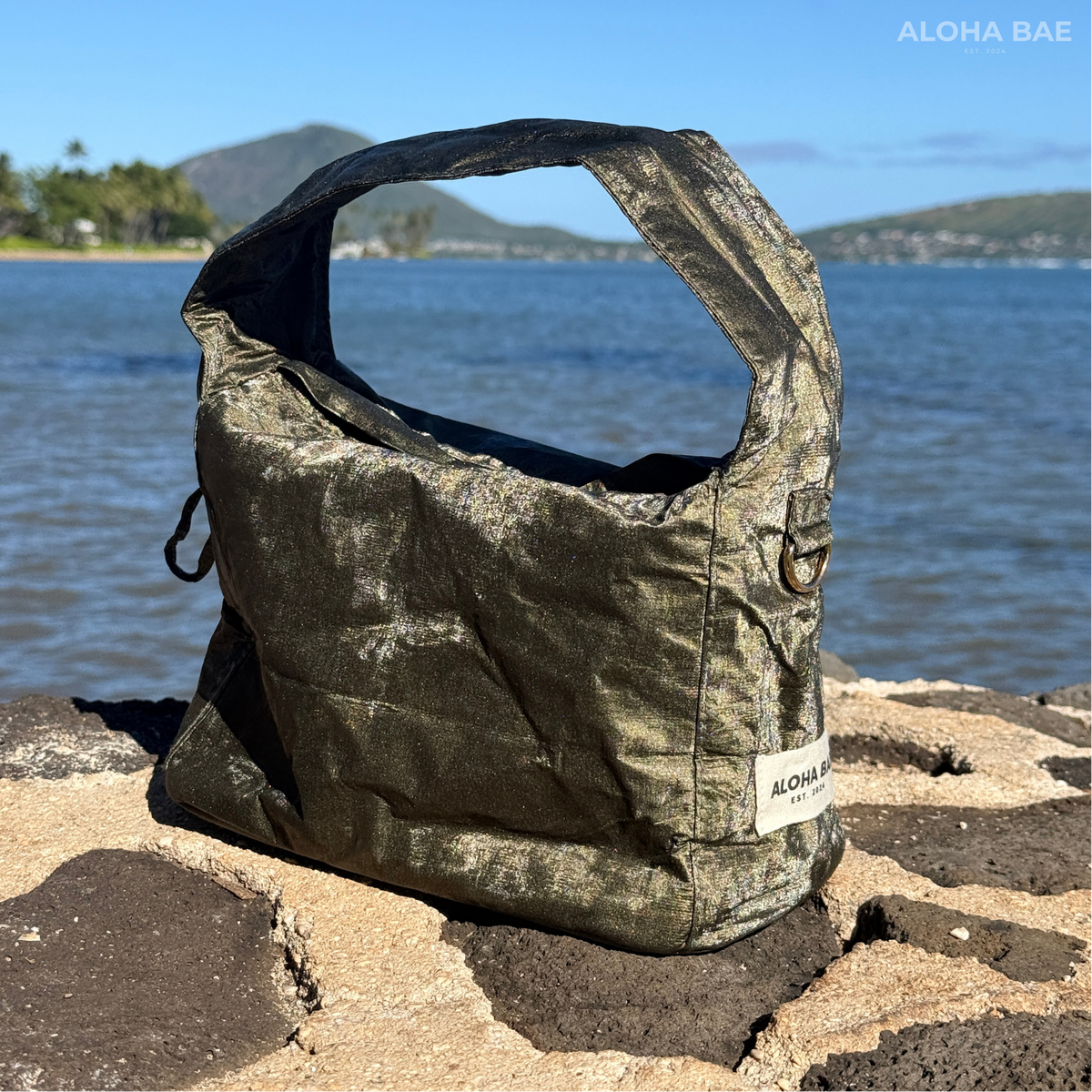 Aloha Bae Maritime Pine hobo bag featuring a stylish, natural woven design with leather strap and nautical-inspired accents.