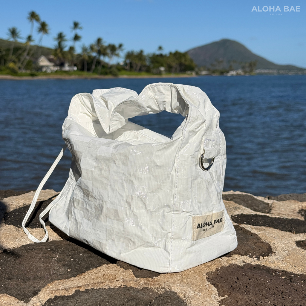 Aloha Bae white plaid hobo bag with a casual, slouchy design and shoulder strap, featuring a stylish plaid pattern.