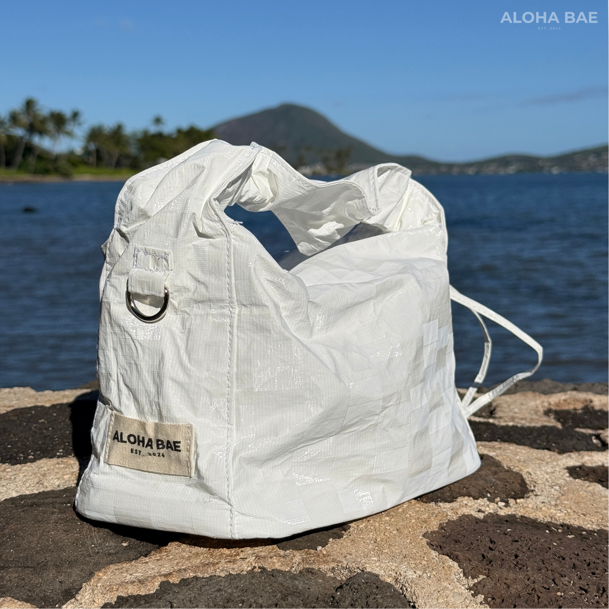 Aloha Bae white plaid hobo bag with adjustable strap and spacious interior, featuring a stylish and casual design.