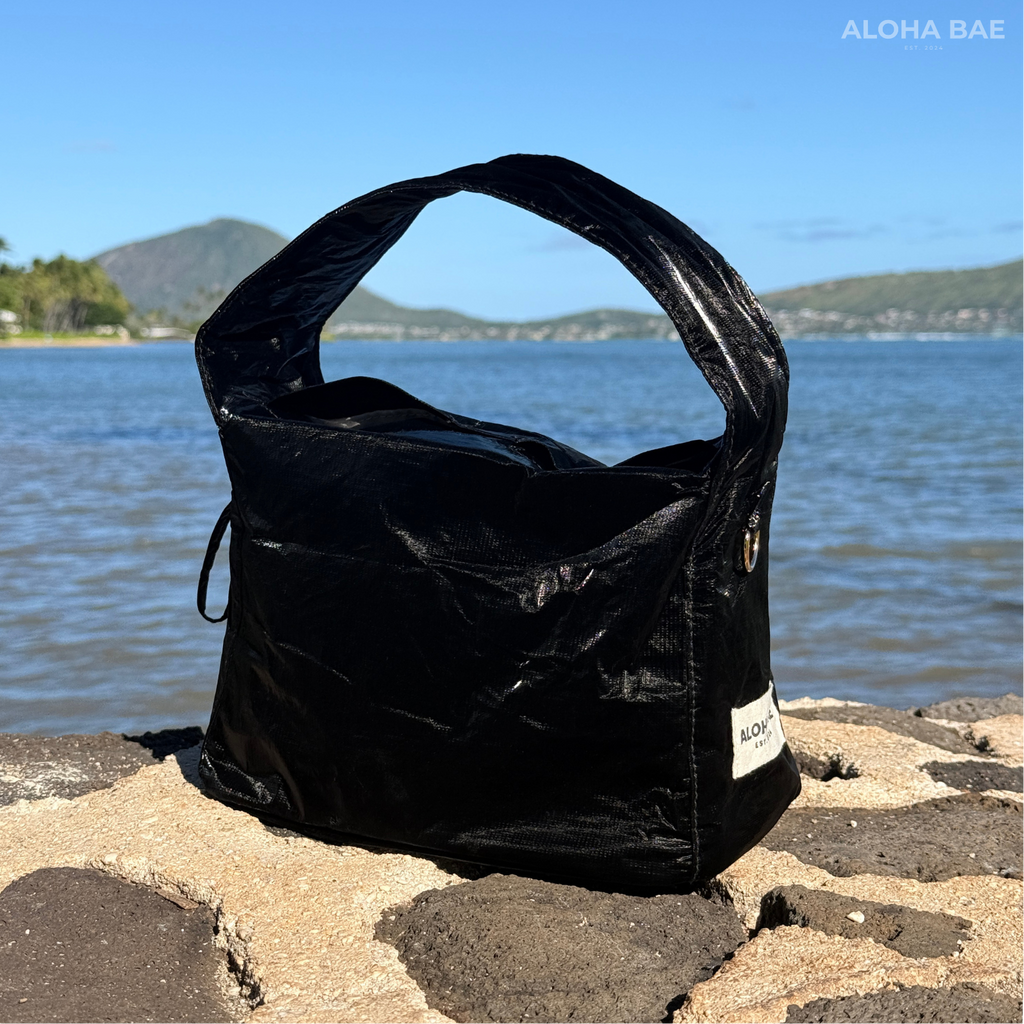 Aloha Bae black sheen hobo bag with slouchy style and shoulder strap, featuring a glossy black finish and casual design.