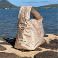 Aloha Bae champagne gold hobo bag with a sleek design, featuring a shoulder strap and stylish metallic finish.