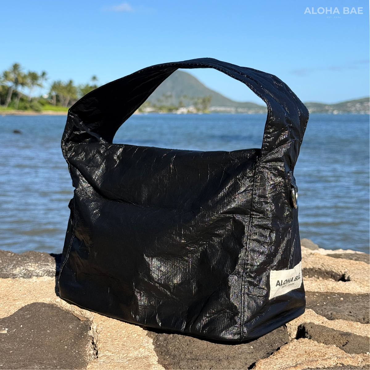 Aloha Bae matte black hobo bag with soft leather texture and slouchy design, featuring a single shoulder strap and minimalist style.