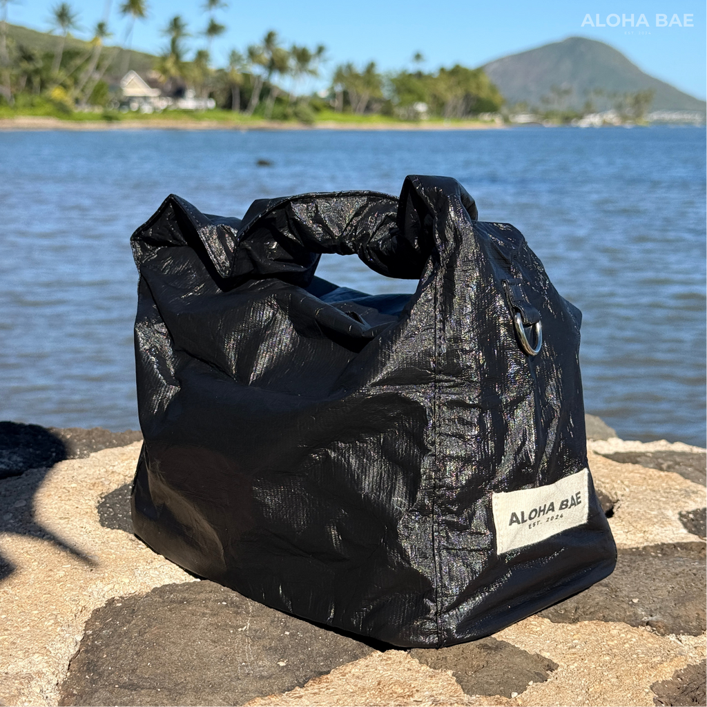 Aloha Bae matte black hobo bag with soft leather texture and slouchy design, featuring a single shoulder strap and minimalist style.