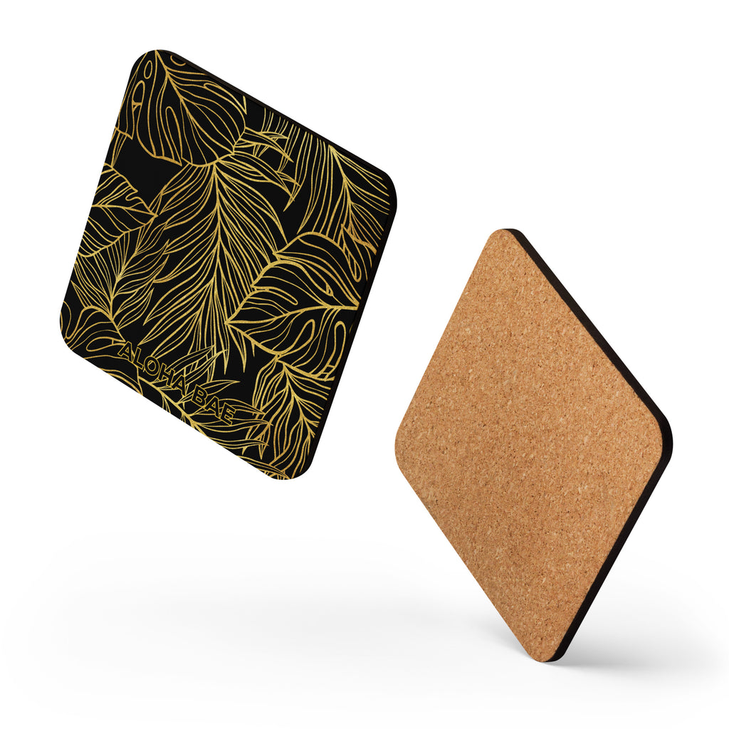 Alohabae black and gold monstera cork-back drink coaster with tropical leaf design on front, natural cork underside visible.