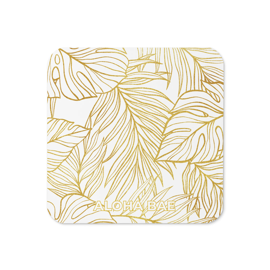 White gold monstera cork-back drink coaster from alohabae featuring a tropical leaf design on cork backing.