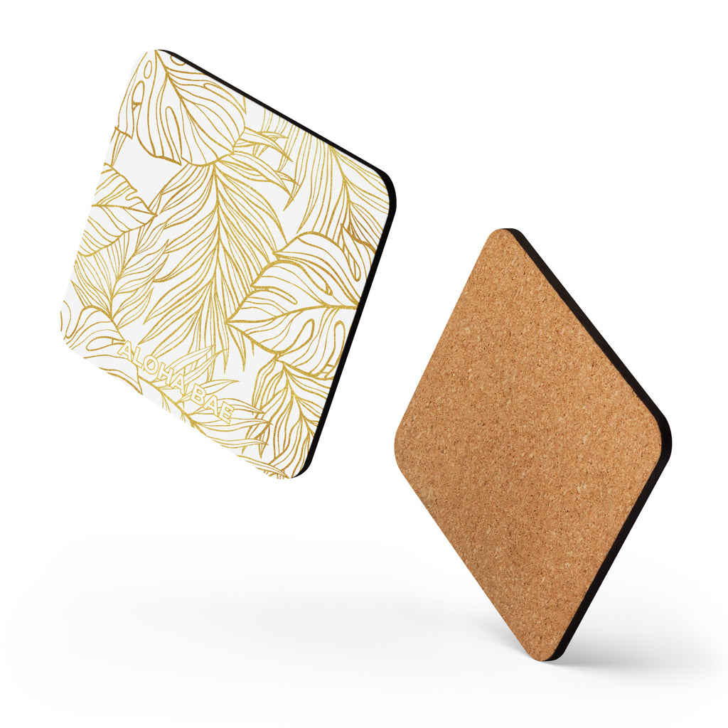 AlohaBae white gold monstera cork-back drink coaster with a tropical leaf design on a white background.