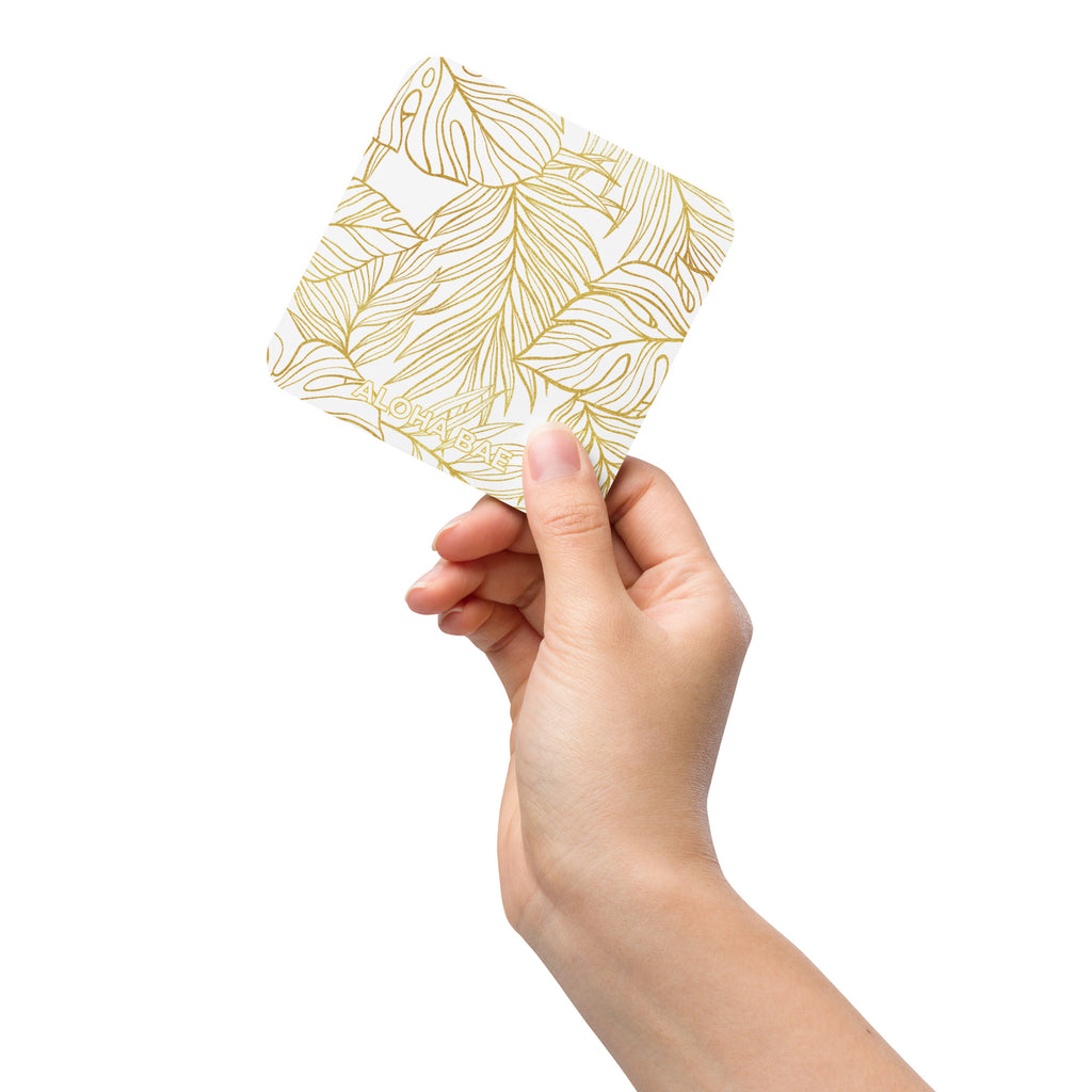 White gold Monstera cork-back drink coaster featuring a tropical leaf design, perfect for protecting surfaces from drinks.